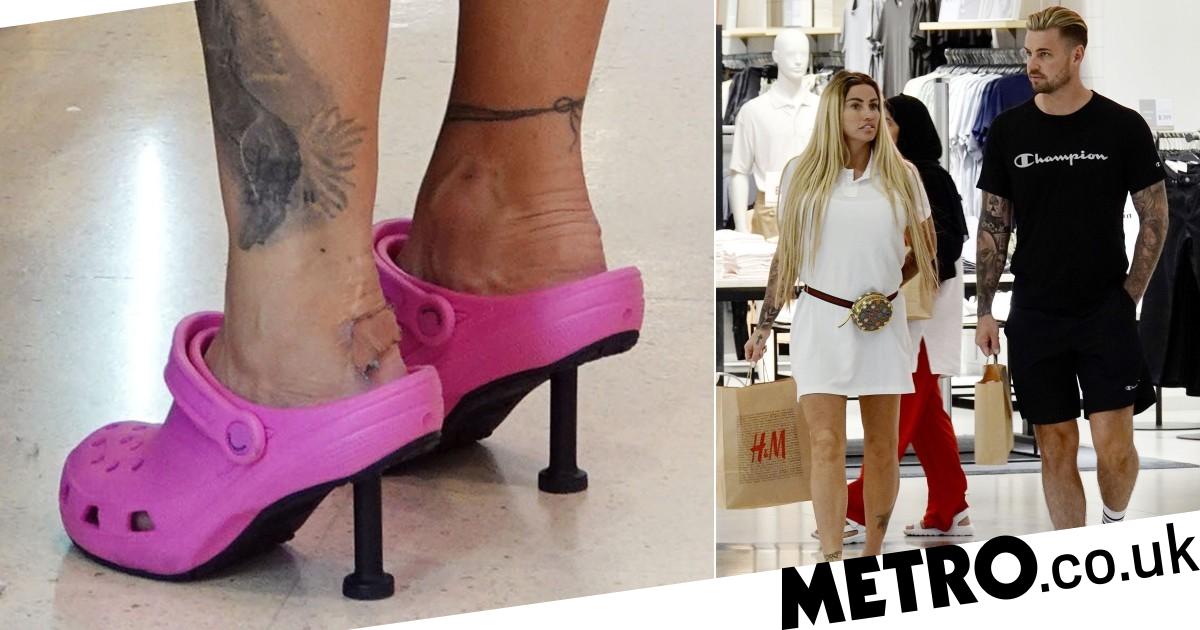 Katie Price rocks high-heeled Crocs on shopping trip with Carl Woods in Thailand
